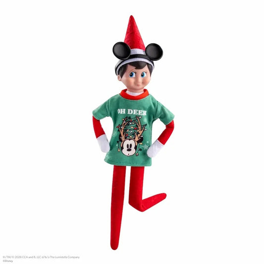 A plush Disney Elf on a Shelf toy with a red and green holiday outfit, Mickey Mouse ears hat, and 'OH DEEK' text on the front, shown against a plain white background.