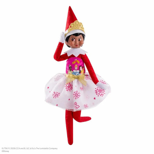 Elf on the Shelf doll in a pink dress with snowflake pattern on a white background