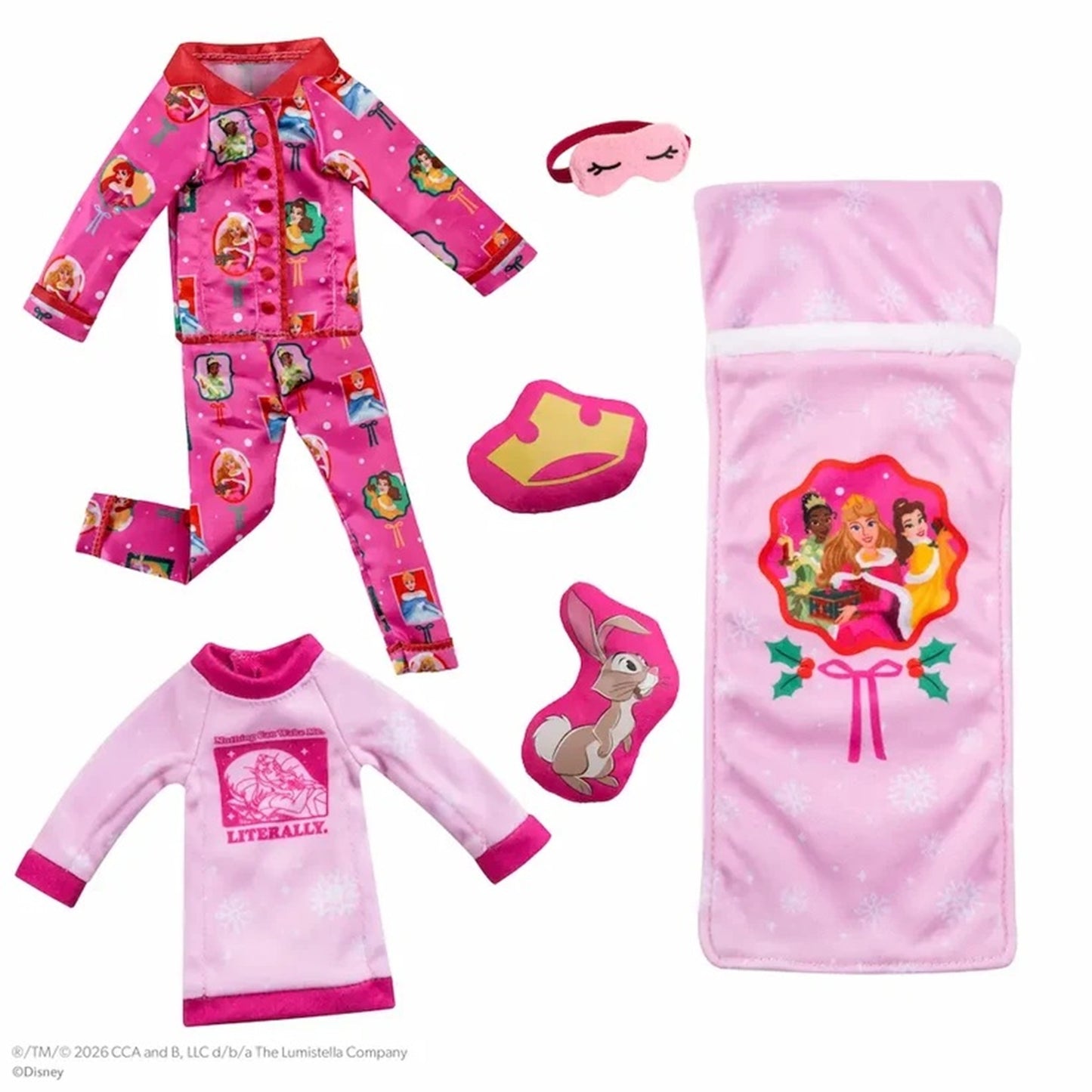 A children's sleepwear set laid out on a white background, including a pink patterned pajama top and matching pants, a light pink long-sleeve pajama shirt, a pink blanket, a pink sleep mask, and pink booties.
