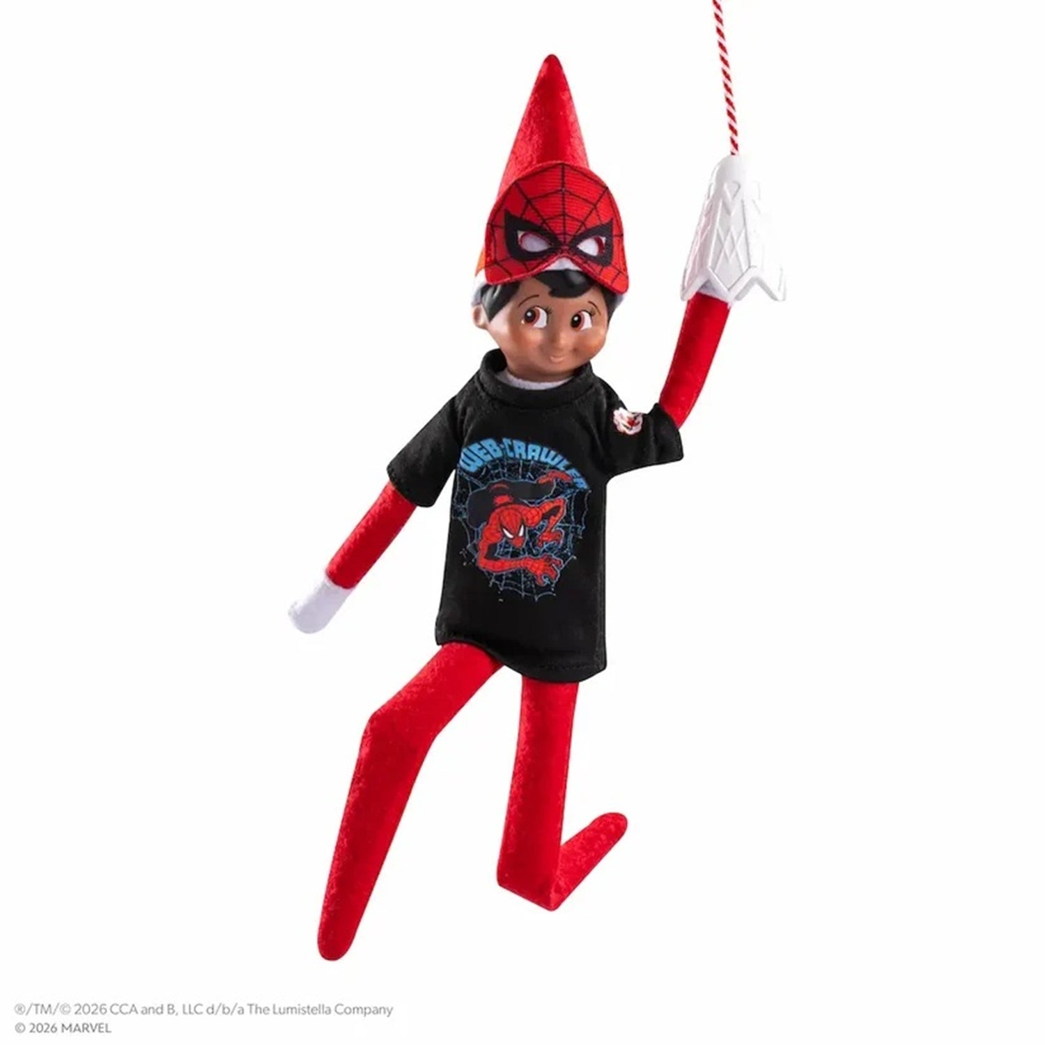A Spider-Man-themed elf doll hanging by a web string against a plain white background. The doll has a red pointed hat, red pants, a black T-shirt with a Spider-Man graphic, and white gloves.