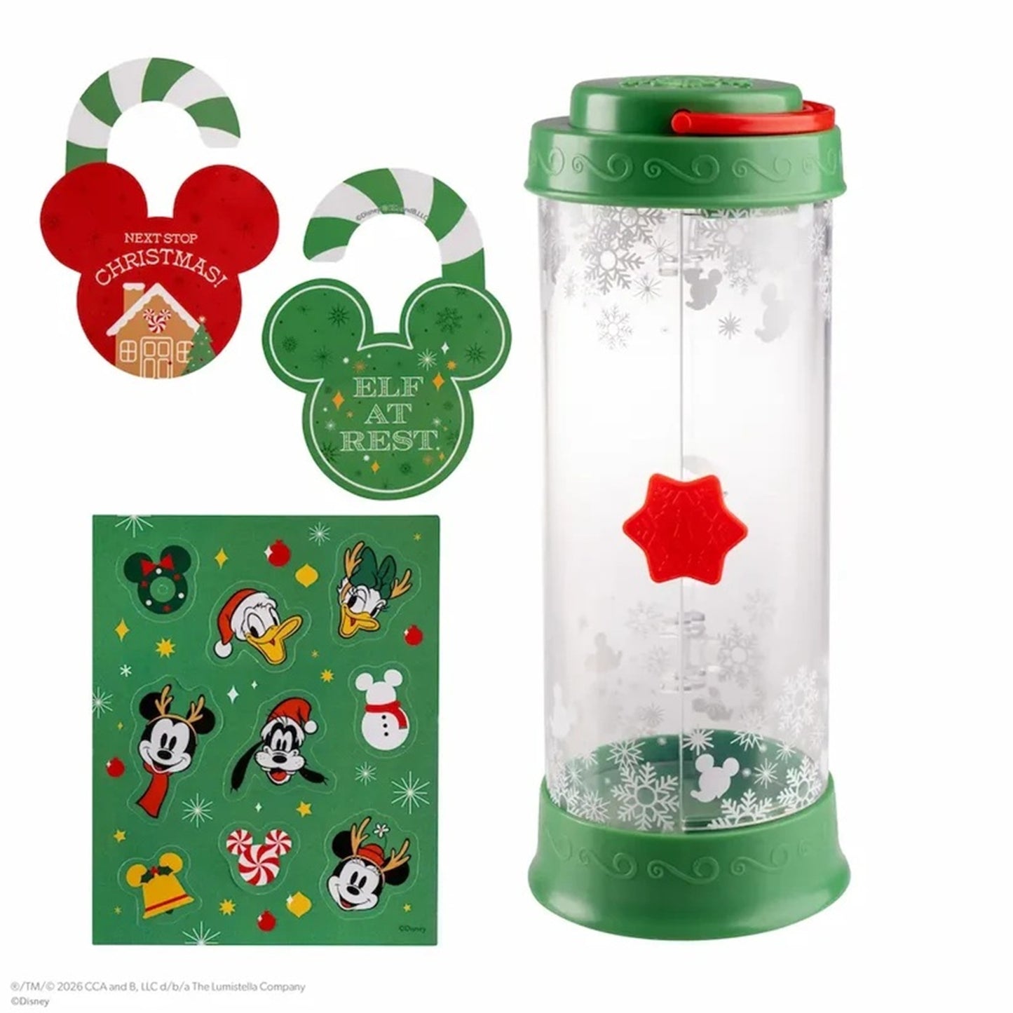 Set of Christmas-themed items including a snow globe, keychains, and a card with cartoon characters on a white background.