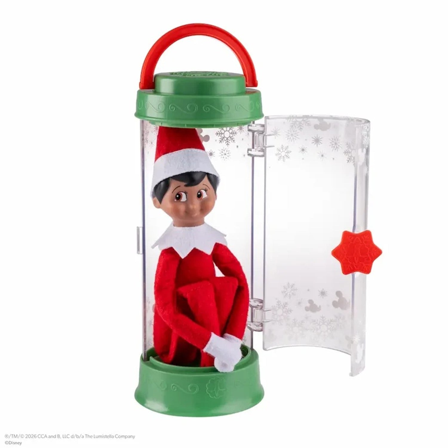 Elf on the Shelf toy in a clear container with green base and red lid on a white background