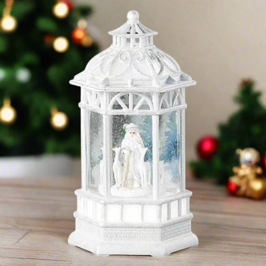 Roman 10.5" White and Blue LED Swirl Santa with Deer Christmas Tabletop Decor