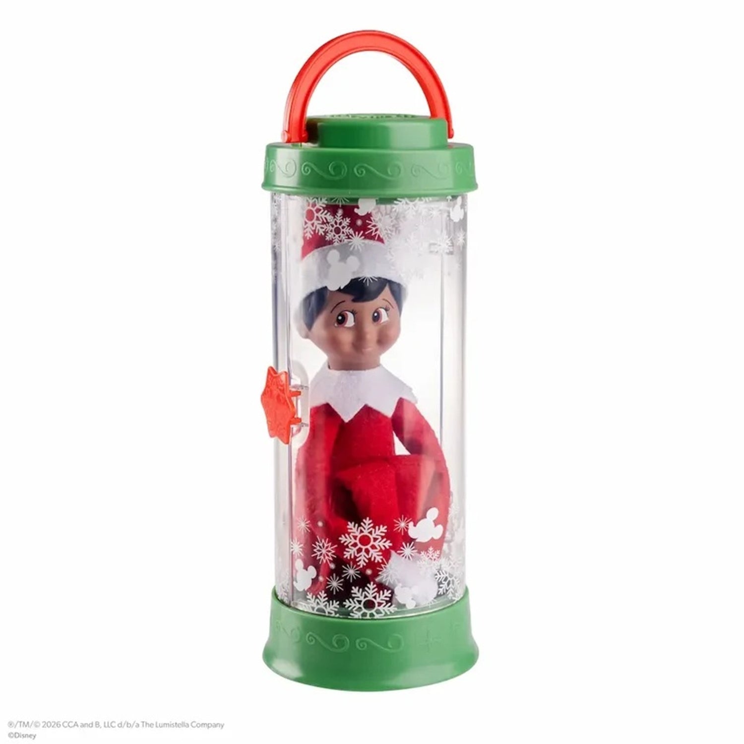 A Disney 'Elf' snow globe toy featuring a small Elf character inside a clear cylindrical container with a green lid and base, a red handle, and white snowflake decorations.