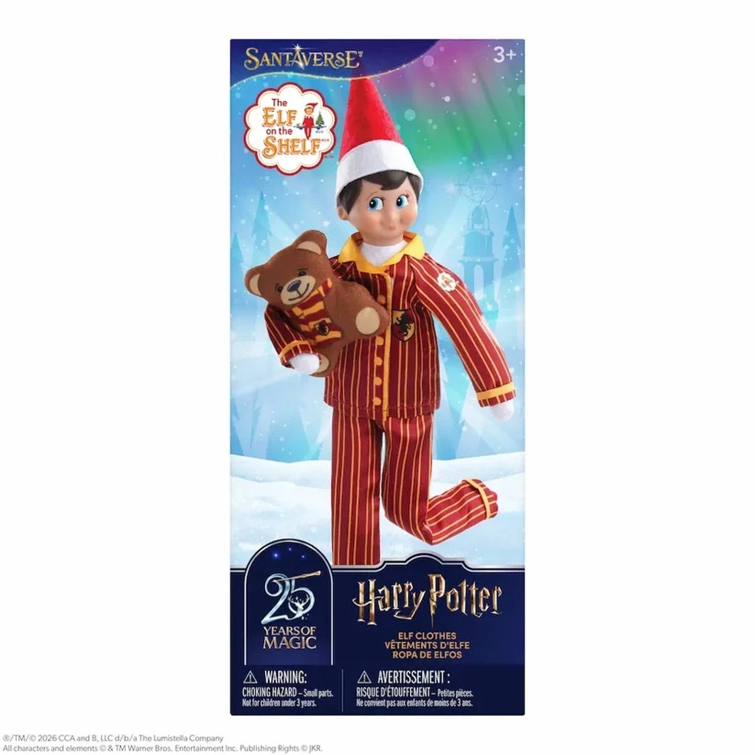 The Elf on the Shelf SantaVerse x Harry Potter 25th Anniversary Edition, shown in its original retail packaging. The box features a photo of the elf wearing a red and gold striped pajama set and holding a brown teddy bear, set against a snowy blue background with SantaVerse and Harry Potter branding.