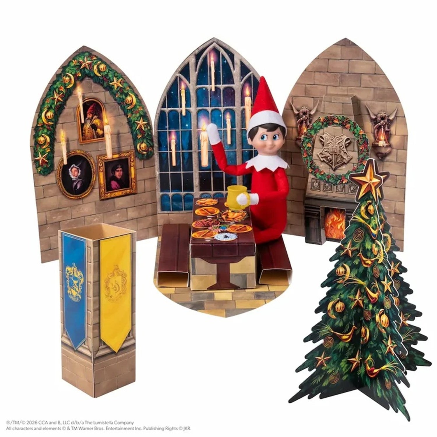 A Harry Potter-themed elf on shelf holiday display set featuring three arched backdrop panels with Hogwarts scenes, a miniature table with food, a blue and gold banner, and a decorated Christmas tree, all arranged on a white background.