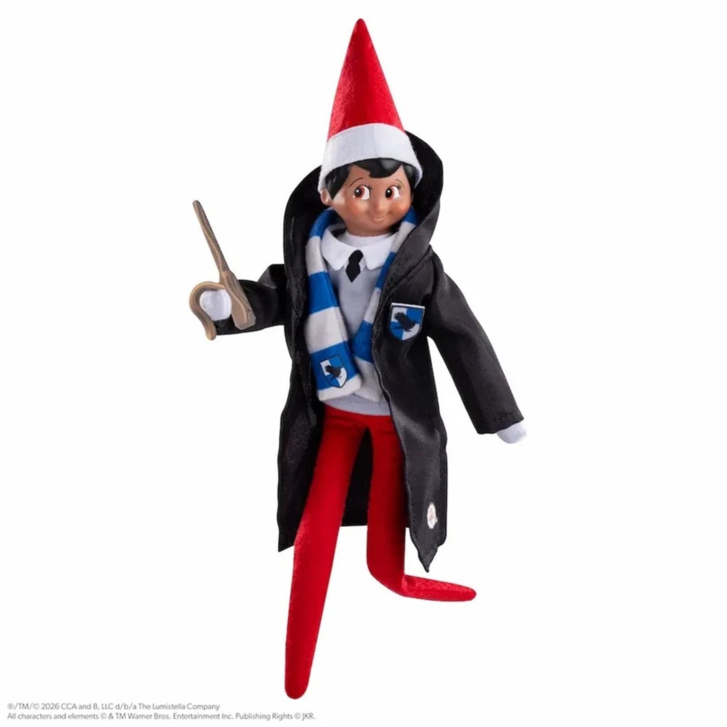 Elf on a Shelf toy figure dressed as a wizard, wearing a red pointed hat, black coat, blue and white striped scarf, white shirt, and red pants, holding a wand against a plain white background.