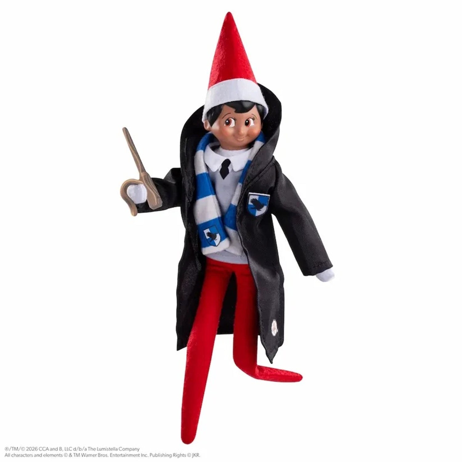 Elf on a Shelf toy figure dressed as a wizard, wearing a red pointed hat, black coat, blue and white striped scarf, white shirt, and red pants, holding a wand against a plain white background.