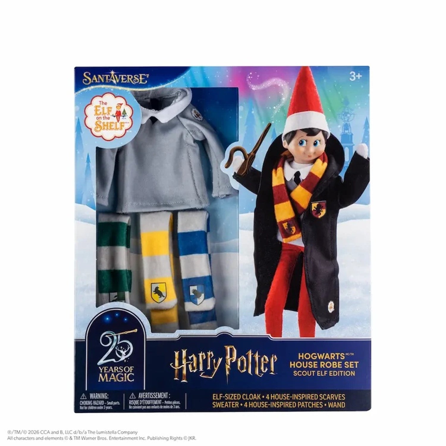 SantaVerse x Harry Potter Hogwarts House Robe Set in its retail packaging, featuring an elf doll dressed in a black robe with a red hat and scarf, alongside a gray robe and green, yellow, and blue striped sweater.