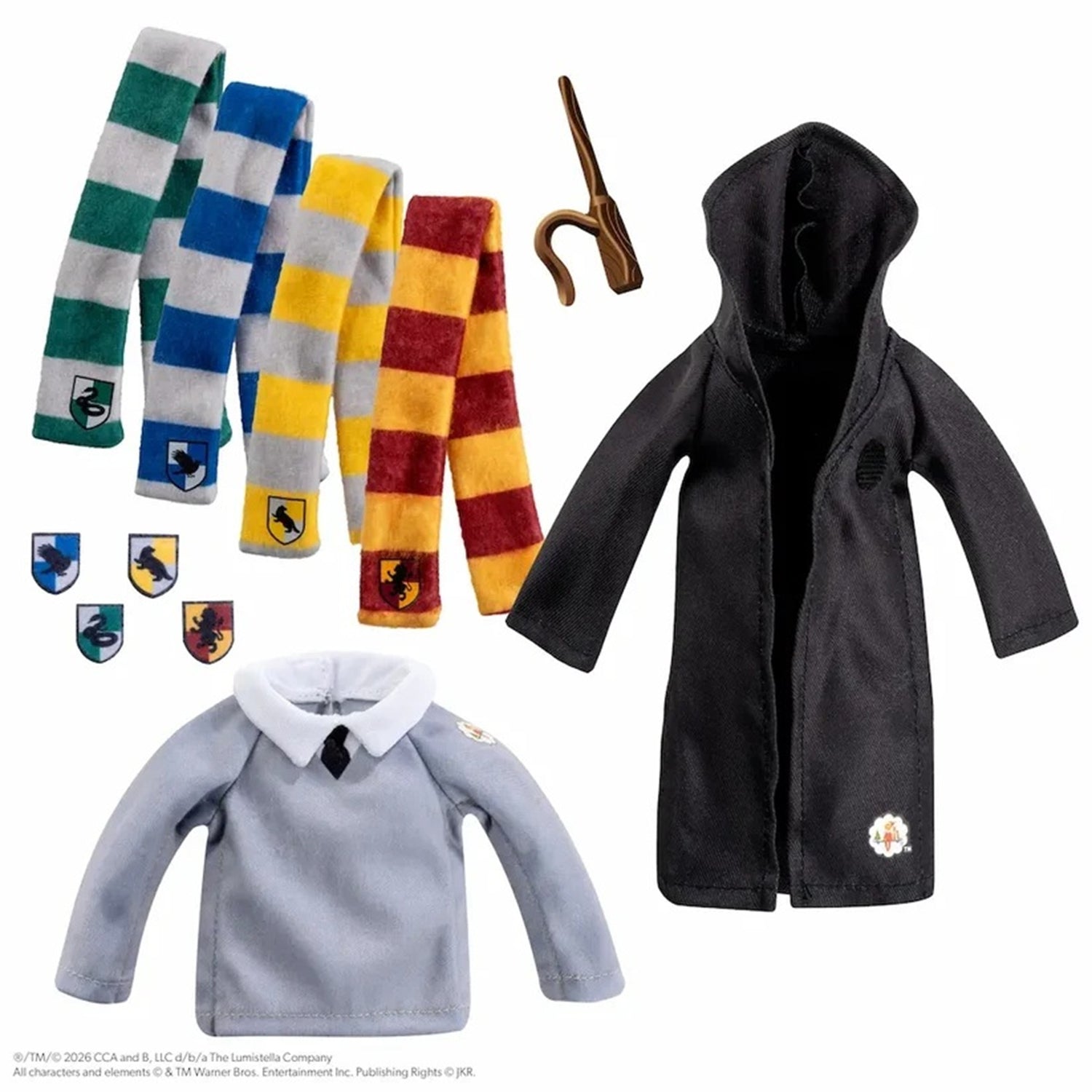 A doll-sized Hogwarts themed clothing set on a white background, including a black hooded robe, a light gray sweater with a white collar and black tie, three striped scarves in green, blue, and yellow, and a brown wand.