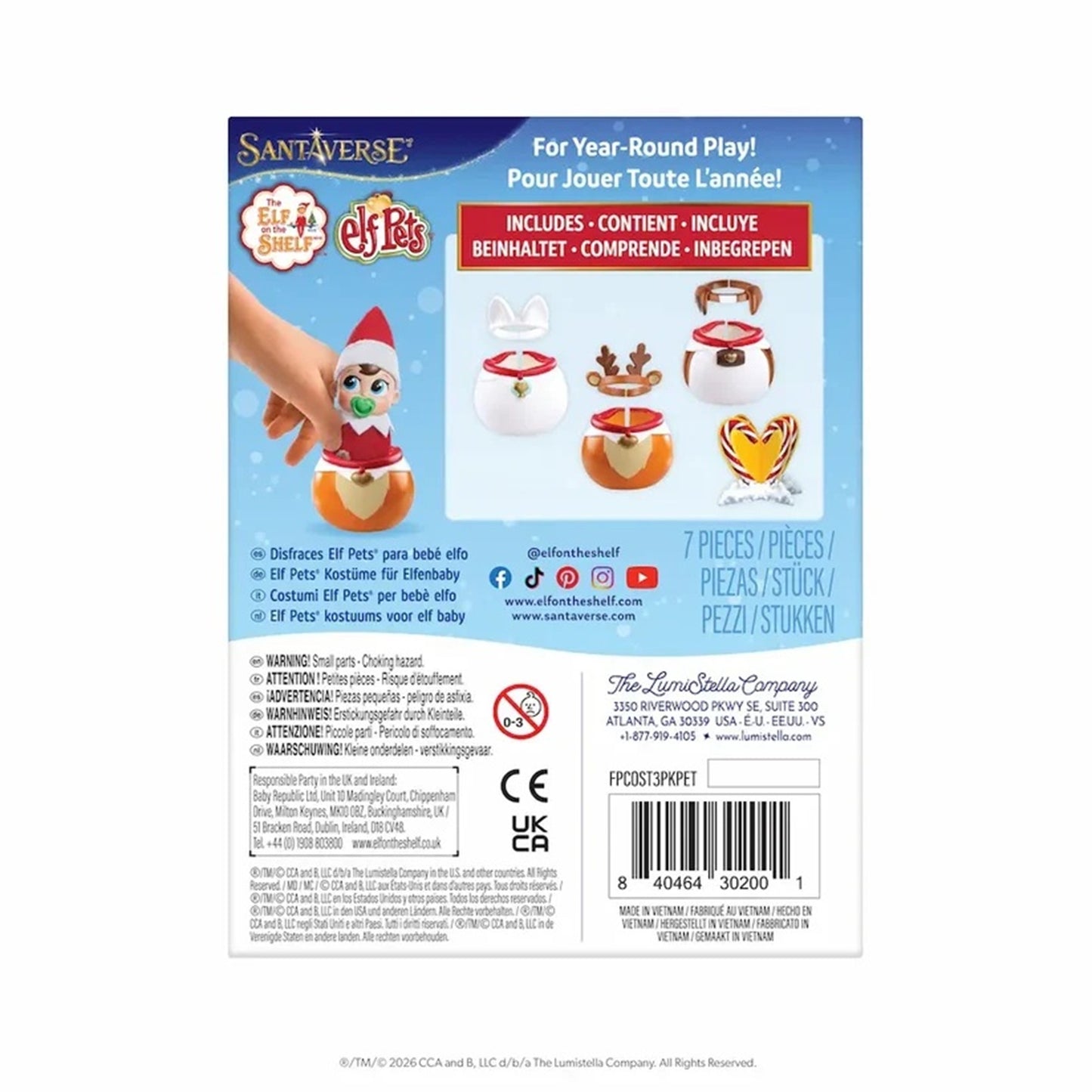 Back of Santa's Elves For Year-Round Play packaging, showing product contents, instructions, warnings, barcode, and a photo of a hand holding an Elf Paèl.