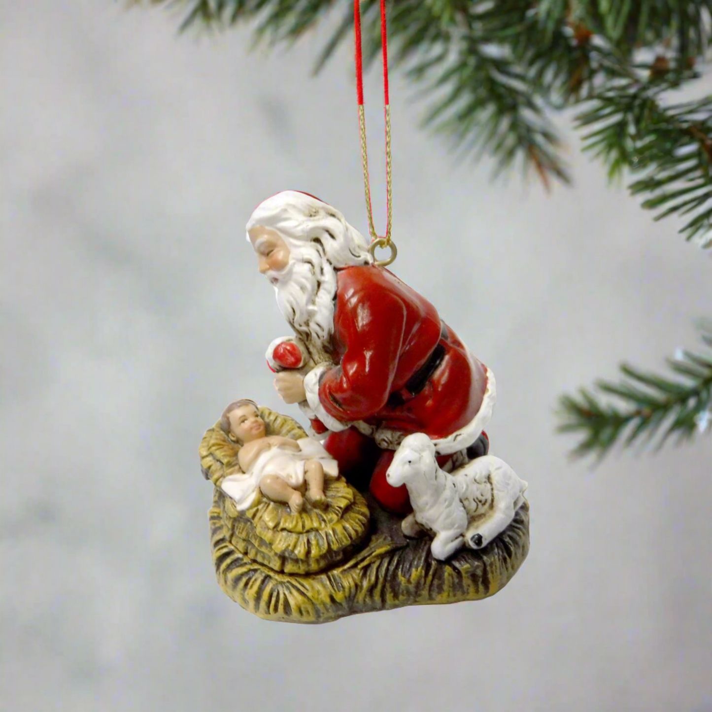 Kneeling Santa with Baby Jesus Ornament