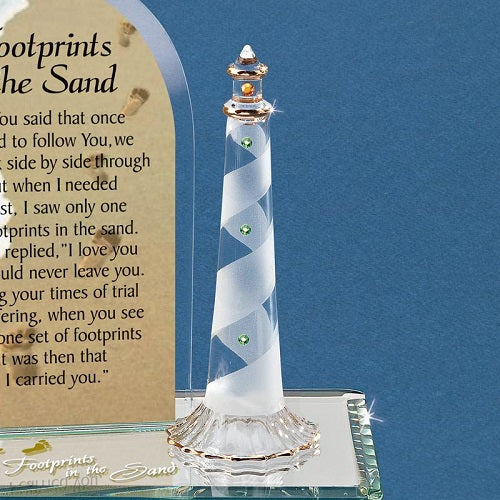 Figurine empreintes de pas du baron de verre dans le sable